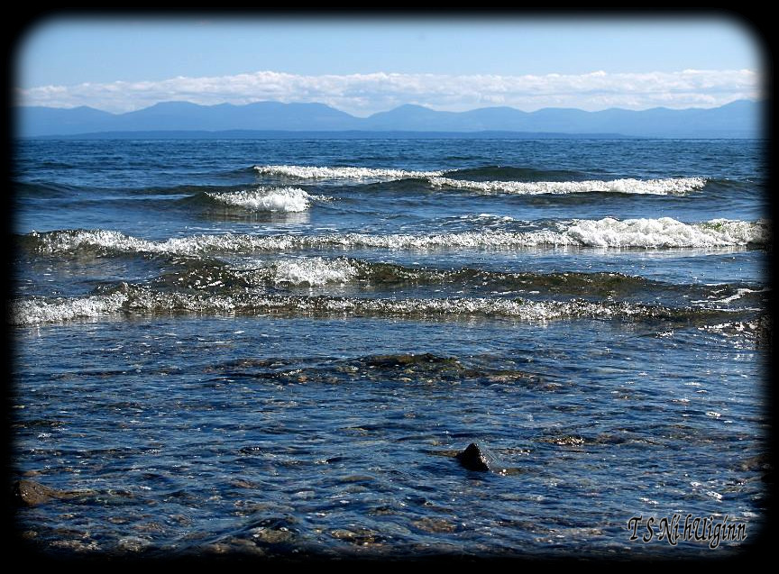 Waves on the beach of Pacific West Coast Mainland with Vancouver Island in the Background taken with Olympus Evolt E-300 by Coastal Salish Photographer TS Ni hUiginn