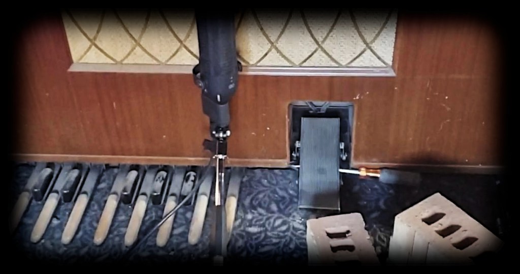 A still image of a microphone recording an organ from Paul Clifford's Jawshop Adventure audio recording studios