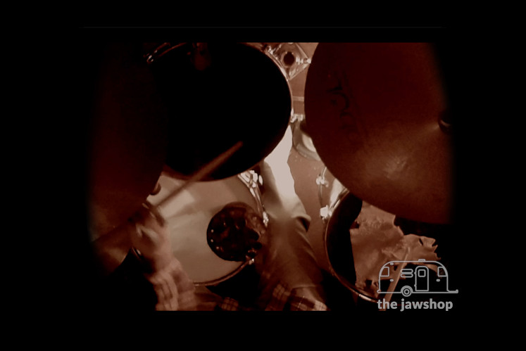 Musician Paul Clifford drumming at the jawshop adventure recording studios.