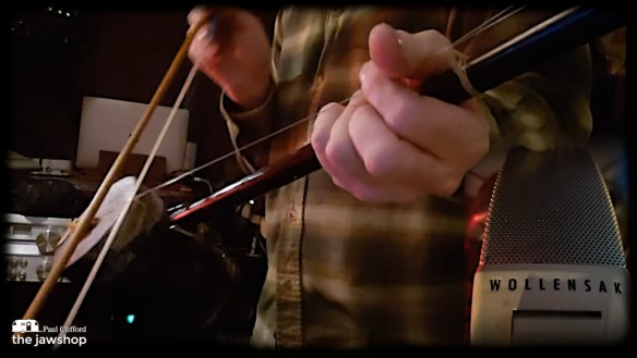 Image of Paul the jawshop Clifford playing and recording an Erhu with a Wollensak reel to reel